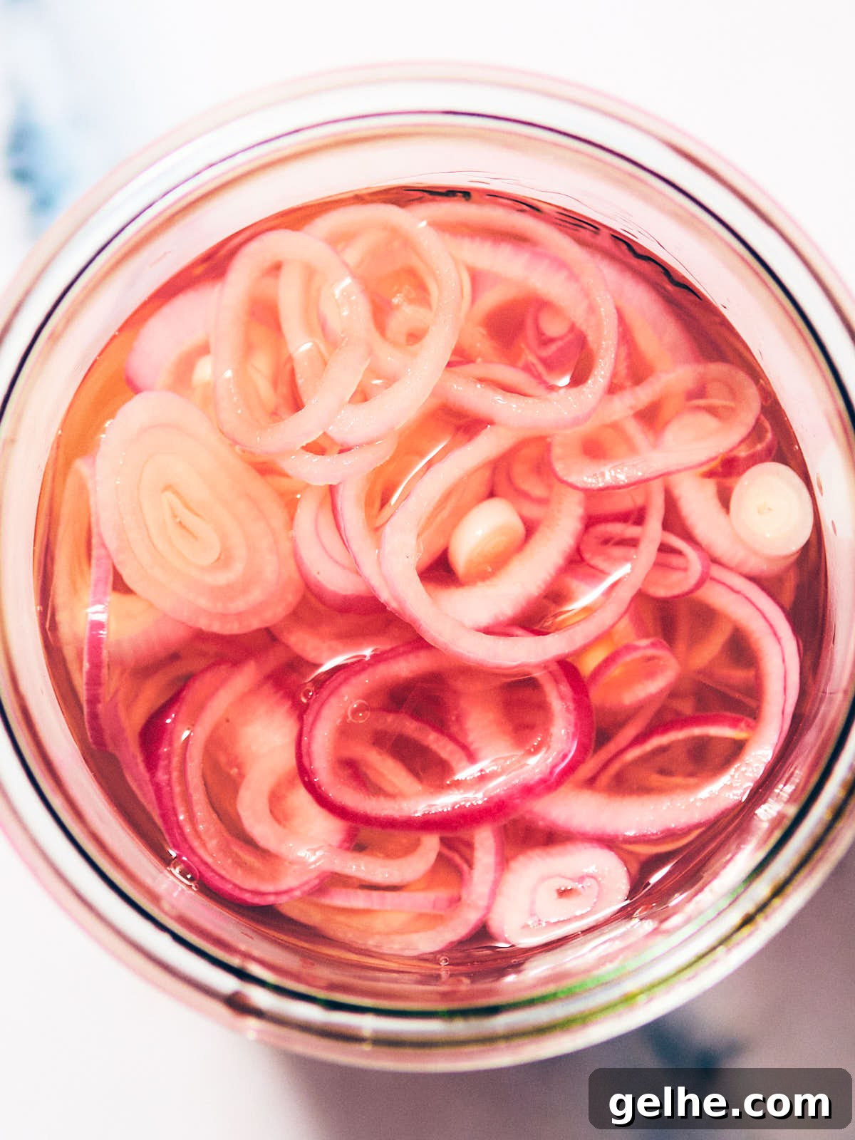 Easy Quick Pickled Shallots in a glass jar.