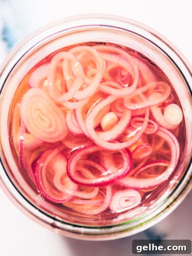 Easy Quick Pickled Shallots in a glass jar.