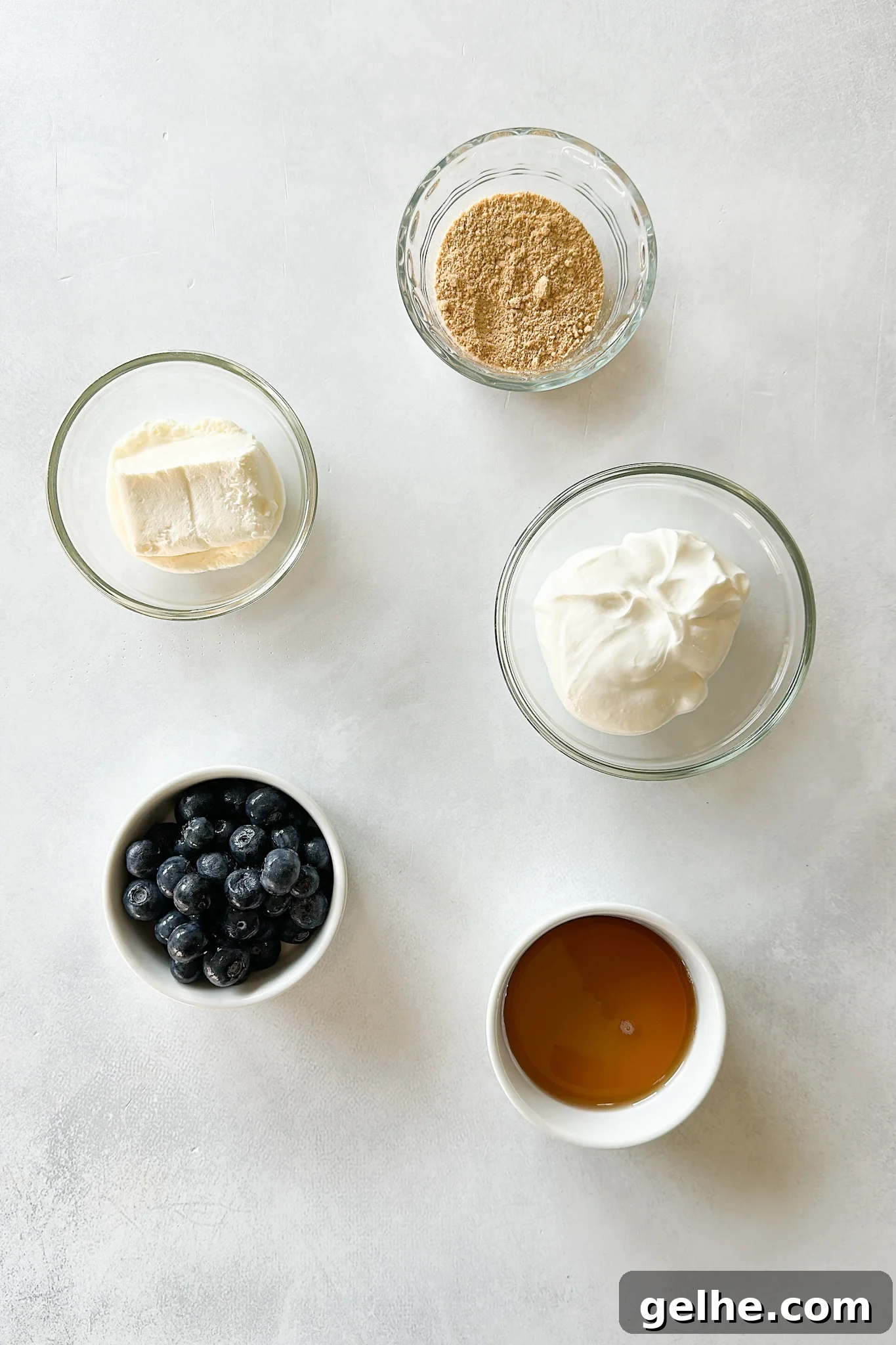 Ingredients to make blueberry cheesecake popsicles.