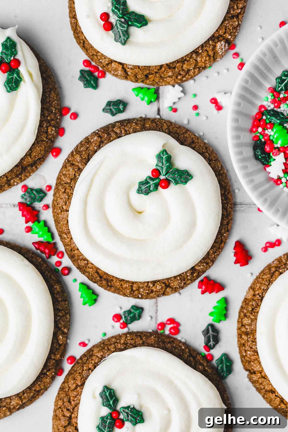 Frosted Gingerbread Cookies Recipe for Holiday Baking 2 frosted gingerbread cookies on a table