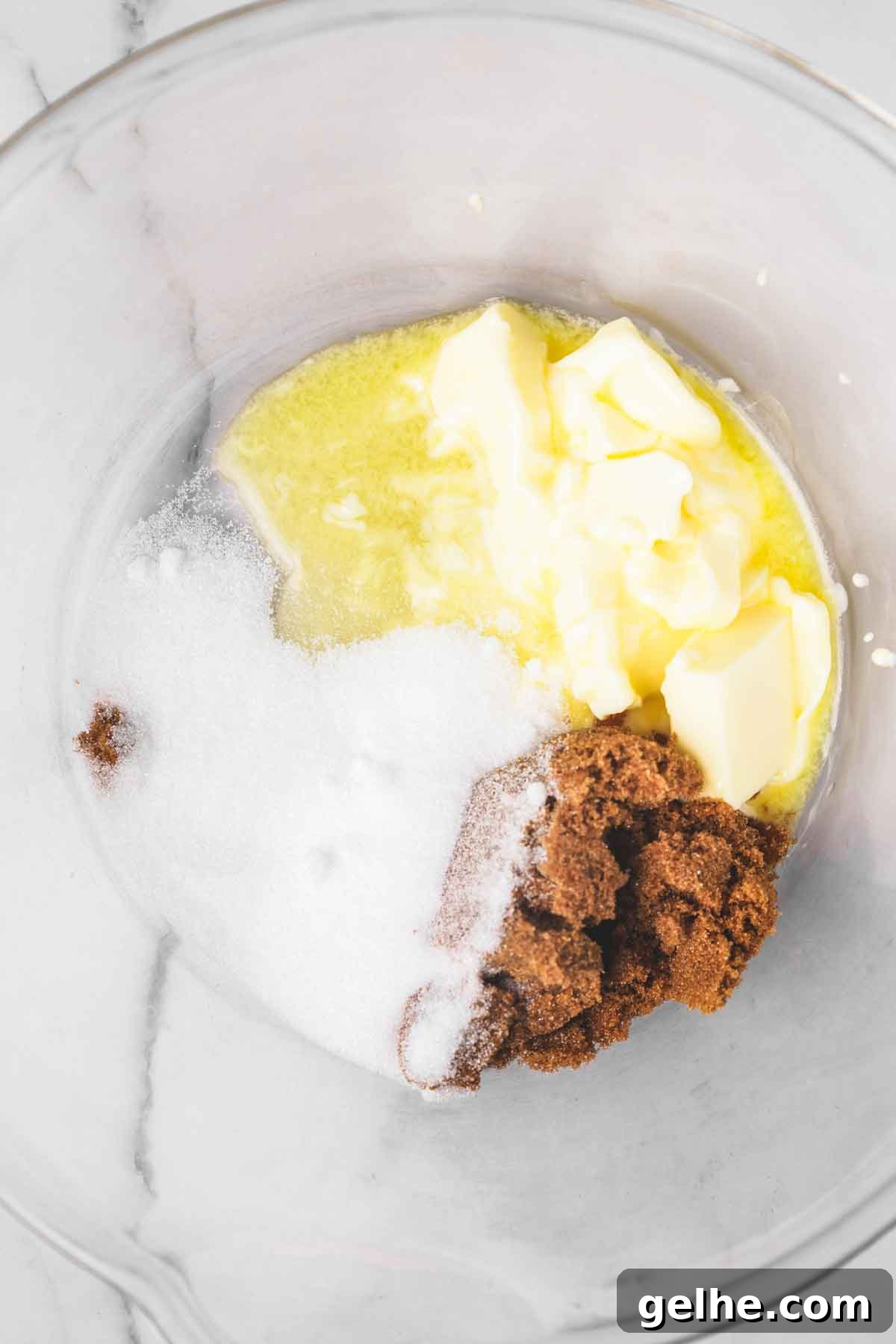 Frosted Gingerbread Cookies Recipe for Holiday Baking 5 large mixing bowl with melted butter granulated sugar and brown sugar