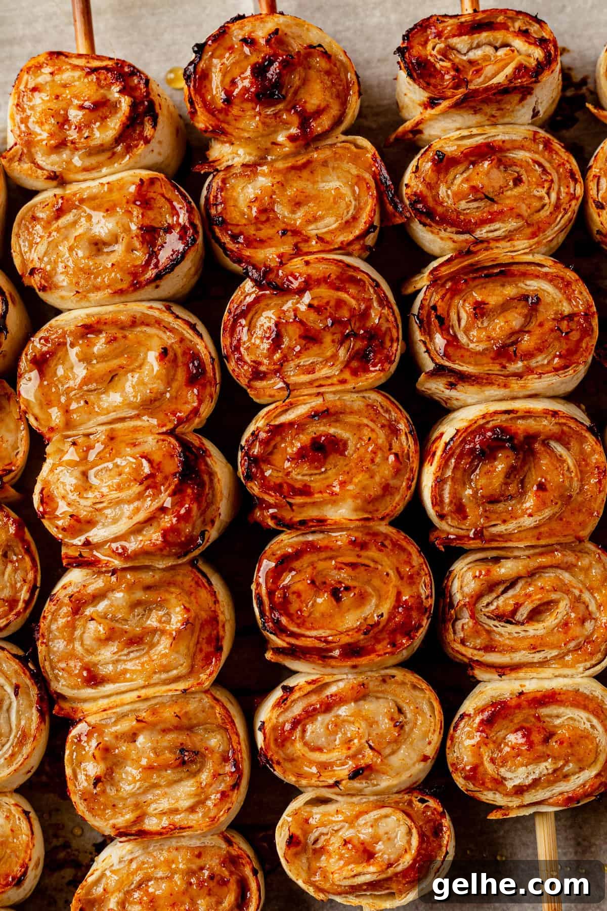 lazy kebab rolls on wooden skewers brushed with hot honey.
