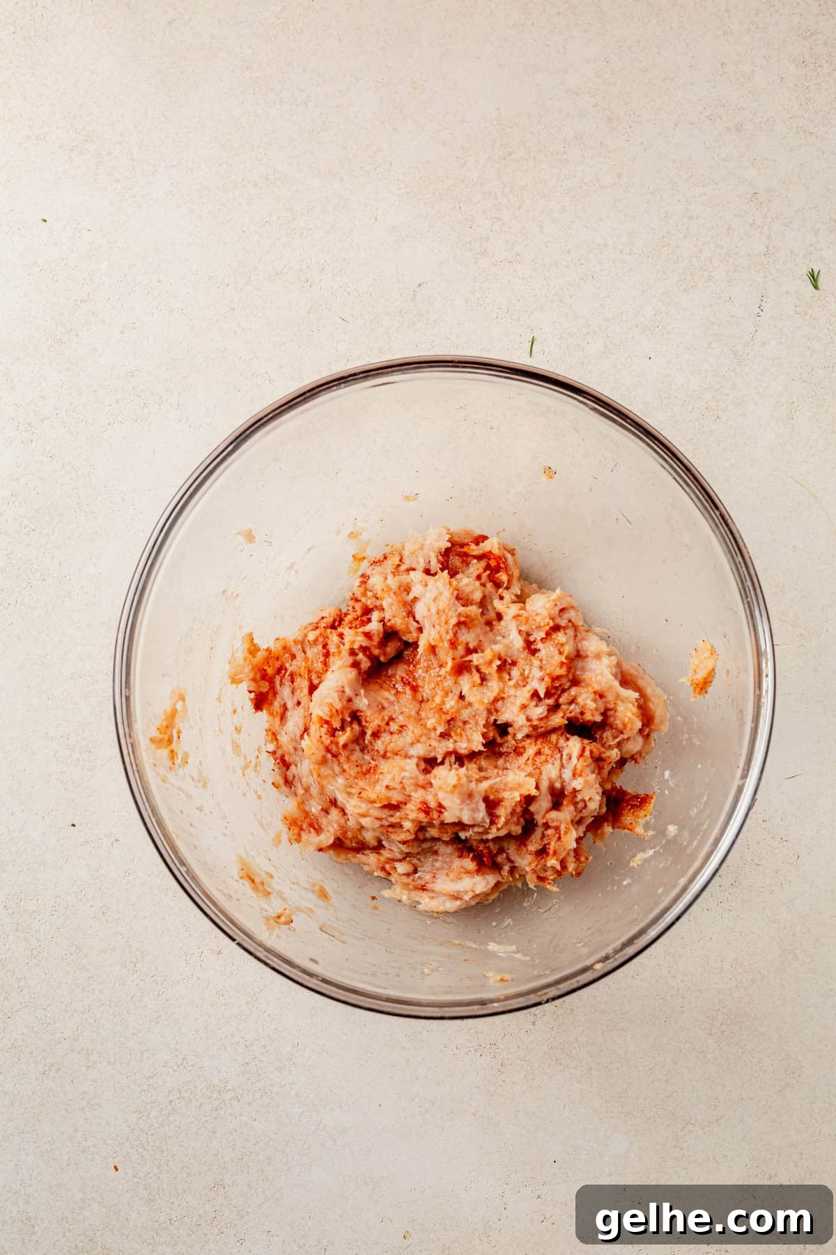 seasoned ground chicken in a mixing bowl.