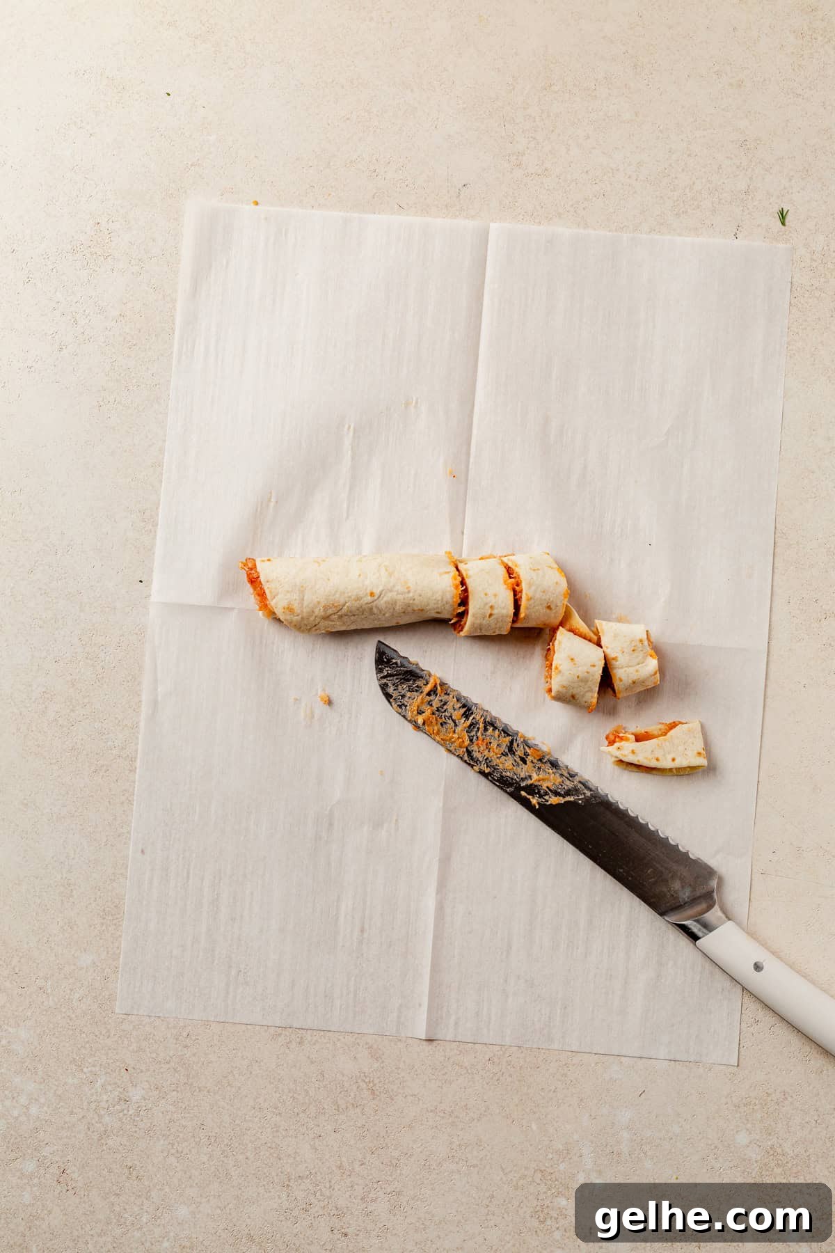 slicing lazy kebab rolls on a counter.
