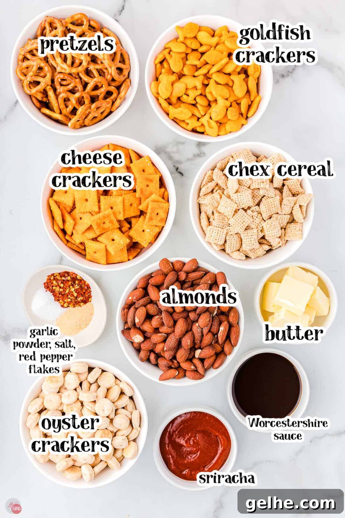 ingredients for spicy chex mix in individual bowls