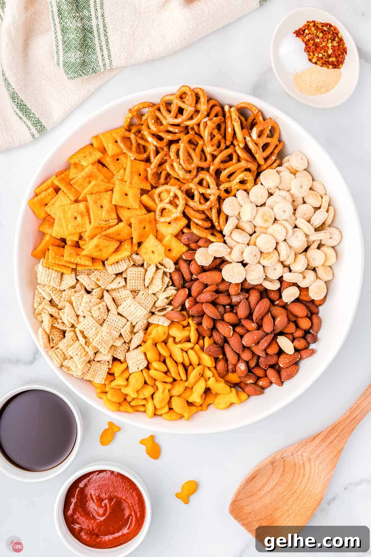 snack mix ingredients in a large microwavable bowl