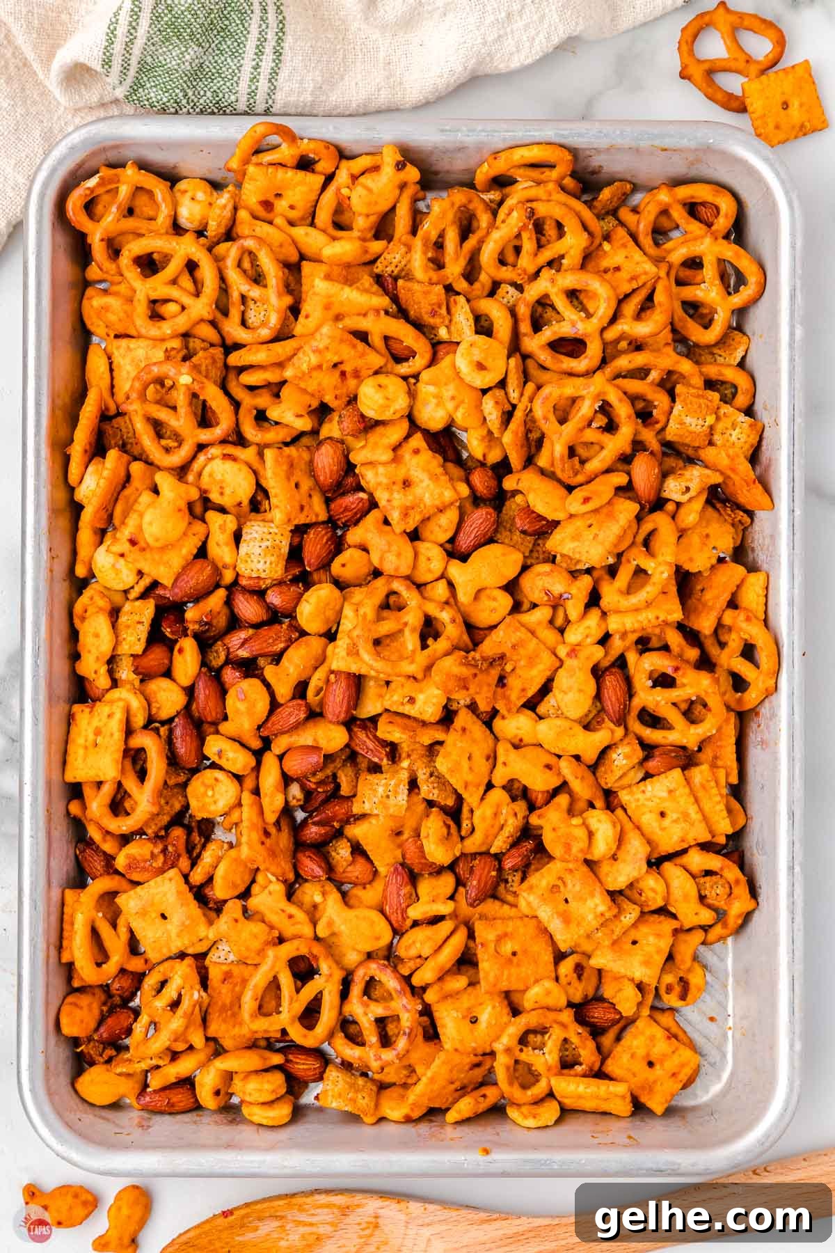 baked spicy chex mix on a baking sheet