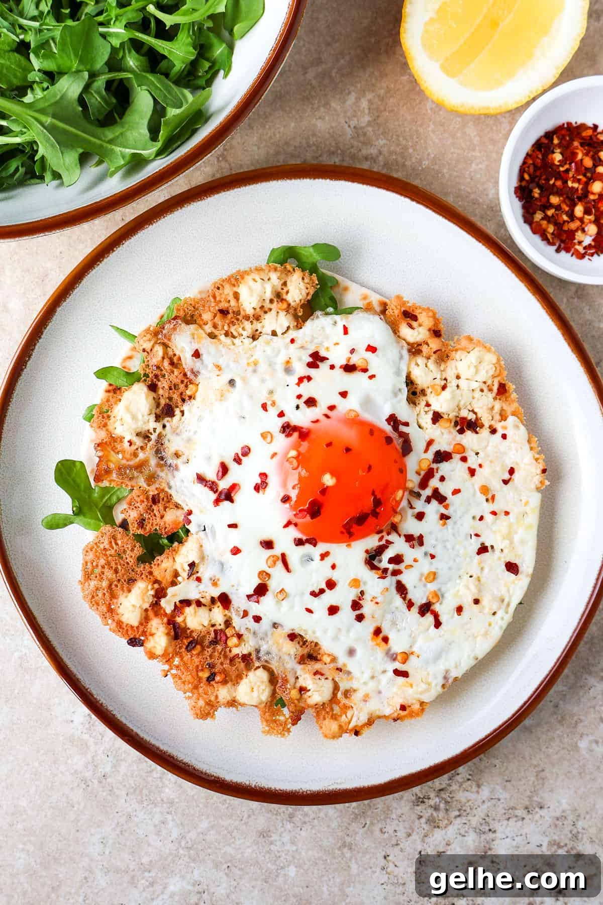 Crispy feta fried egg on a tortilla with arugula.