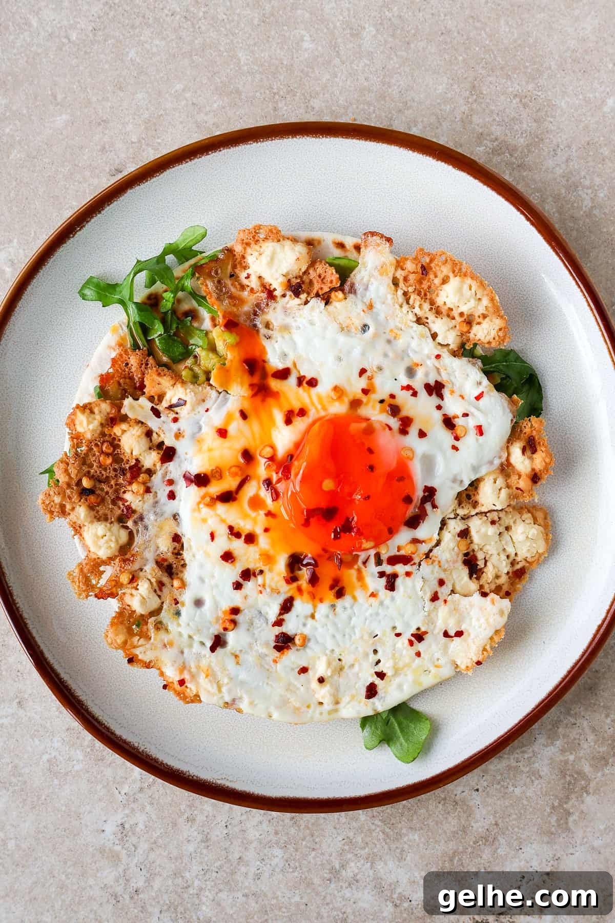 Crispy feta fried egg on a tortilla with a runny yolk.