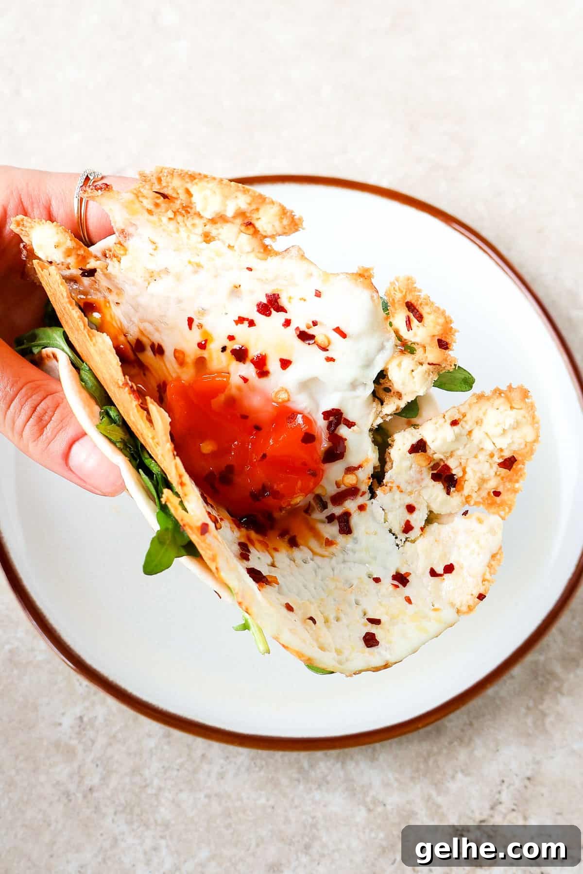 Crispy feta egg taco in hand.