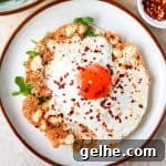 Crispy feta fried egg on a tortilla with arugula.