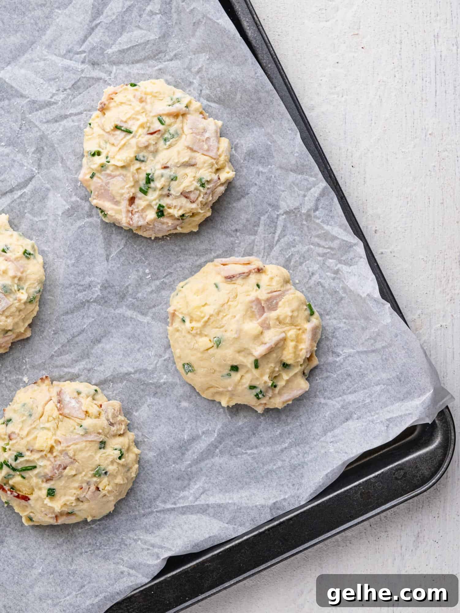High-Protein Biscuits Without Butter – Fluffy, Low-Fat Recipe 13 Protein biscuits on a baking tray before baking.