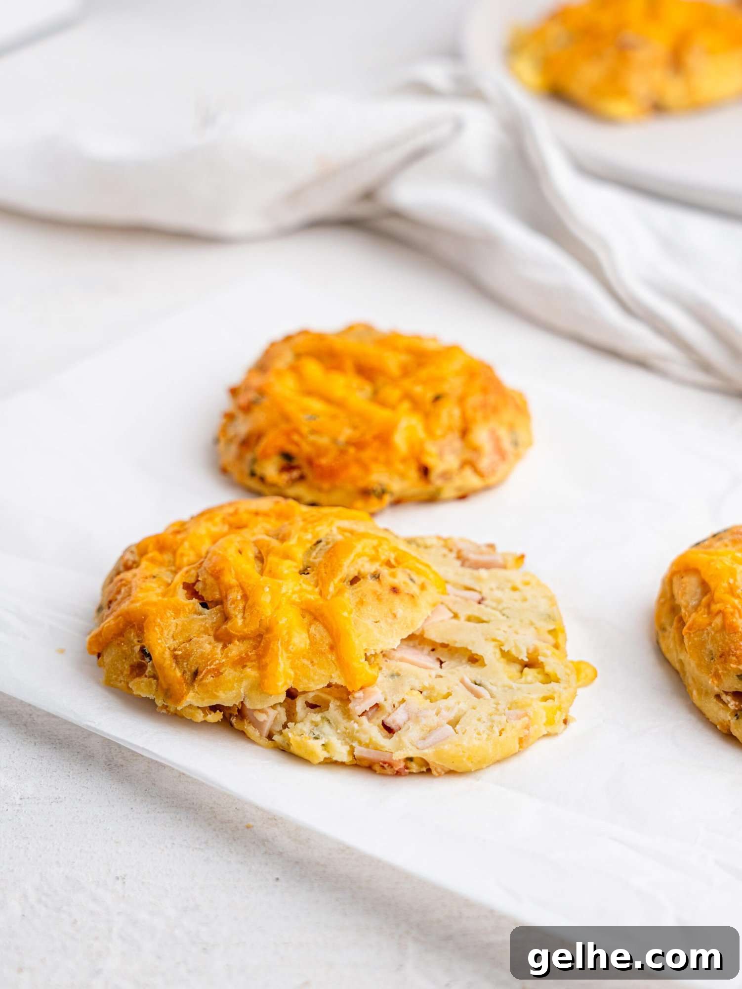 High-Protein Biscuits Without Butter – Fluffy, Low-Fat Recipe 17 A ham and cheese biscuit cut in half.