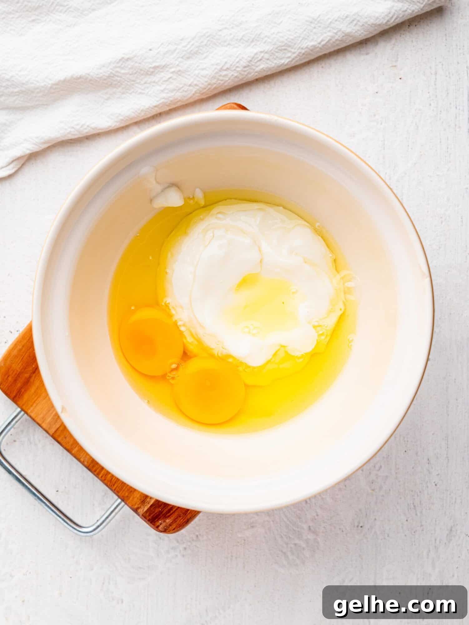 High-Protein Biscuits Without Butter – Fluffy, Low-Fat Recipe 7 Yogurt and eggs in a mixing bowl.