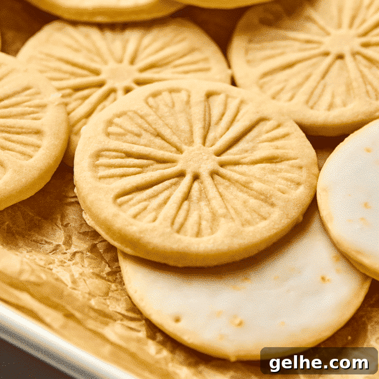 Homemade Girl Scout Lemonade Recipe: Refreshing Copycat Version 13 Upclose image of lemonades cookie on parchment-lined baking tray.