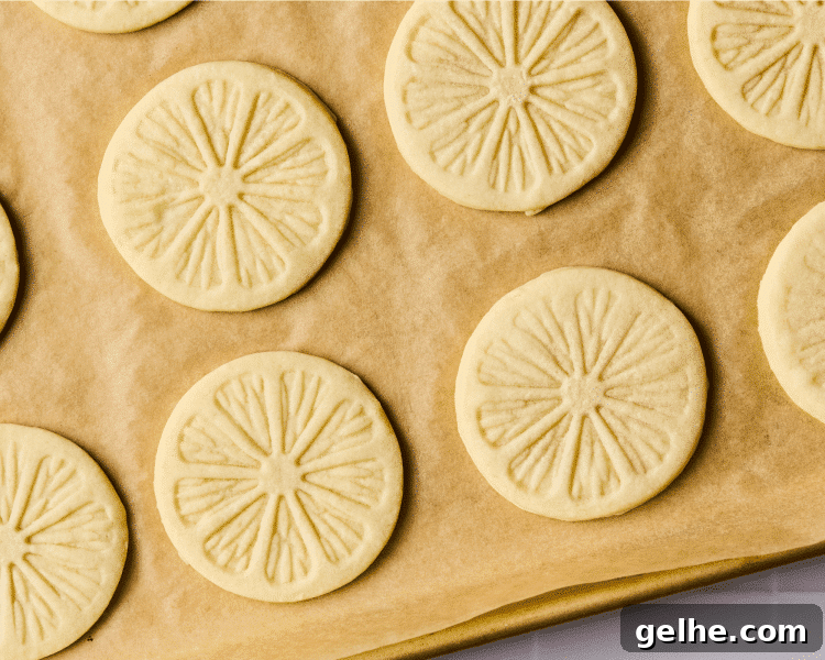 Copycat girl scout lemonade cookies baked on parchment paper lined baking sheet.