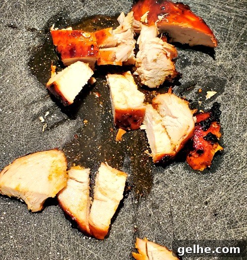 Korean BBQ Grilled Chicken Recipe with Sticky Soy Marinade 6 Grilled Korean BBQ Chicken Breast Cut on a cutting board