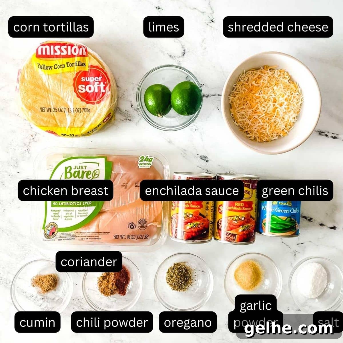 Slow Cooker Shredded Chicken Enchiladas Recipe 3 The labeled ingredients for chicken slow cooker enchiladas are shown on a white marble counter.
