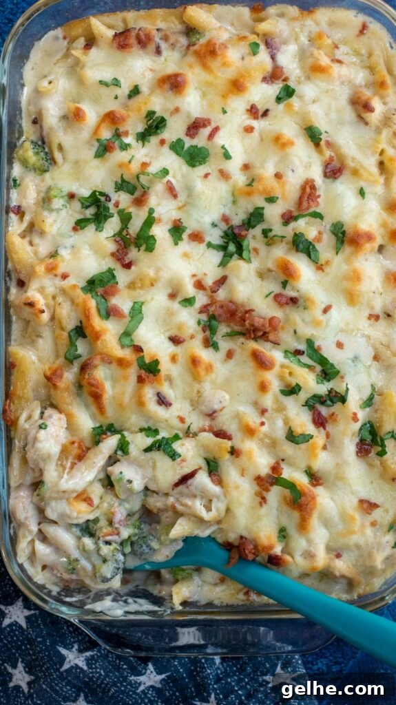 This baked Chicken Broccoli Alfredo Pasta is a hearty upgrade on your favorite fettuccini Alfredo recipe. Made with shredded chicken, crispy bacon, broccoli, homemade Alfredo sauce and tons of cheese, this cheesy chicken Alfredo casserole is an ultimate comfort food favorite!