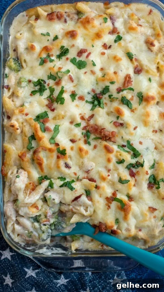 This baked Chicken Broccoli Alfredo Pasta is a hearty upgrade on your favorite fettuccini Alfredo recipe. Made with shredded chicken, crispy bacon, broccoli, homemade Alfredo sauce and tons of cheese, this cheesy chicken Alfredo casserole is an ultimate comfort food favorite!