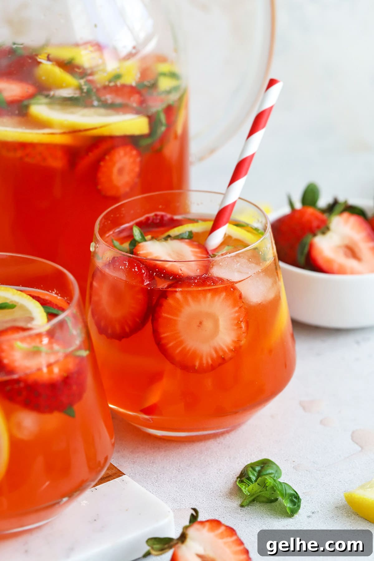 Front view of a glass of homemade strawberry basil lemonade