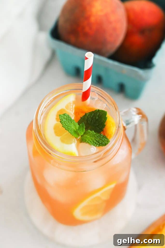 homemade peach lemonade in mason jar glasses