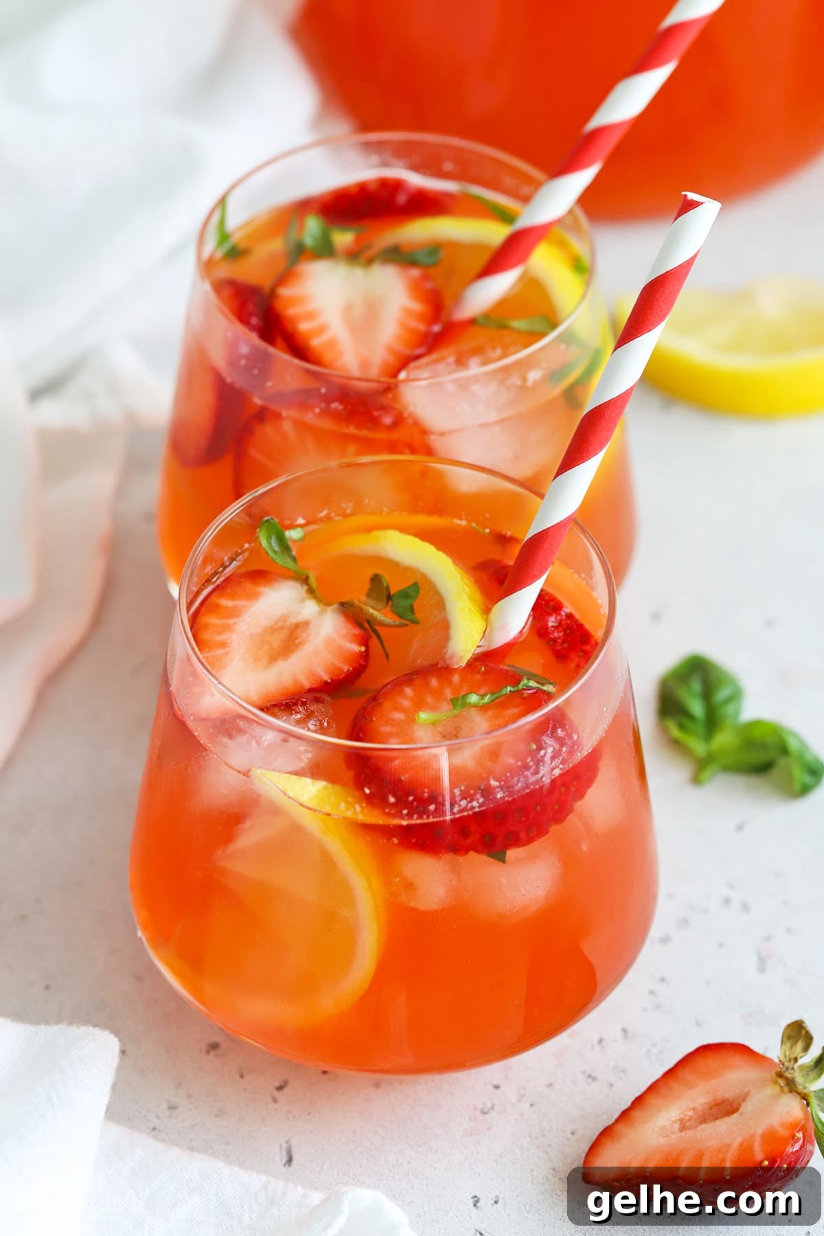Front view of a glass of homemade strawberry basil lemonade