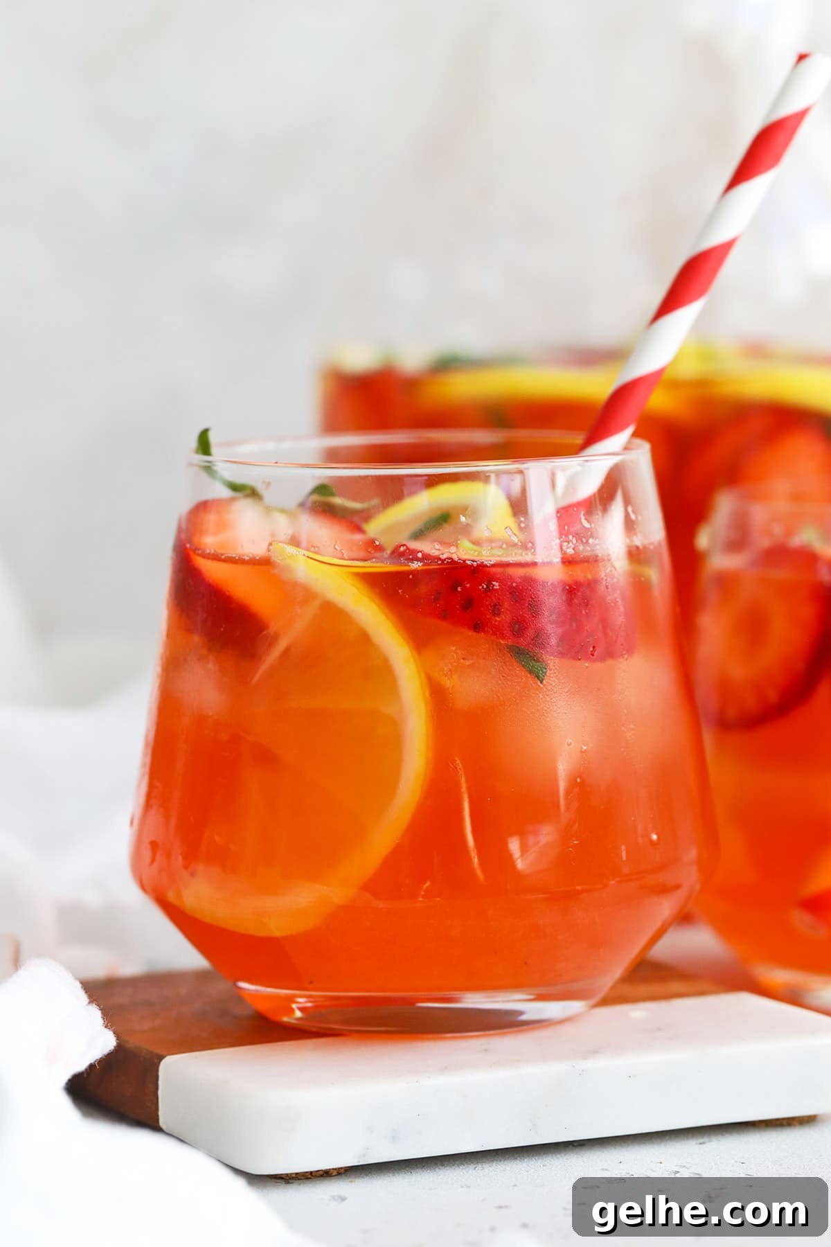 Front view of a glass of homemade strawberry basil lemonade