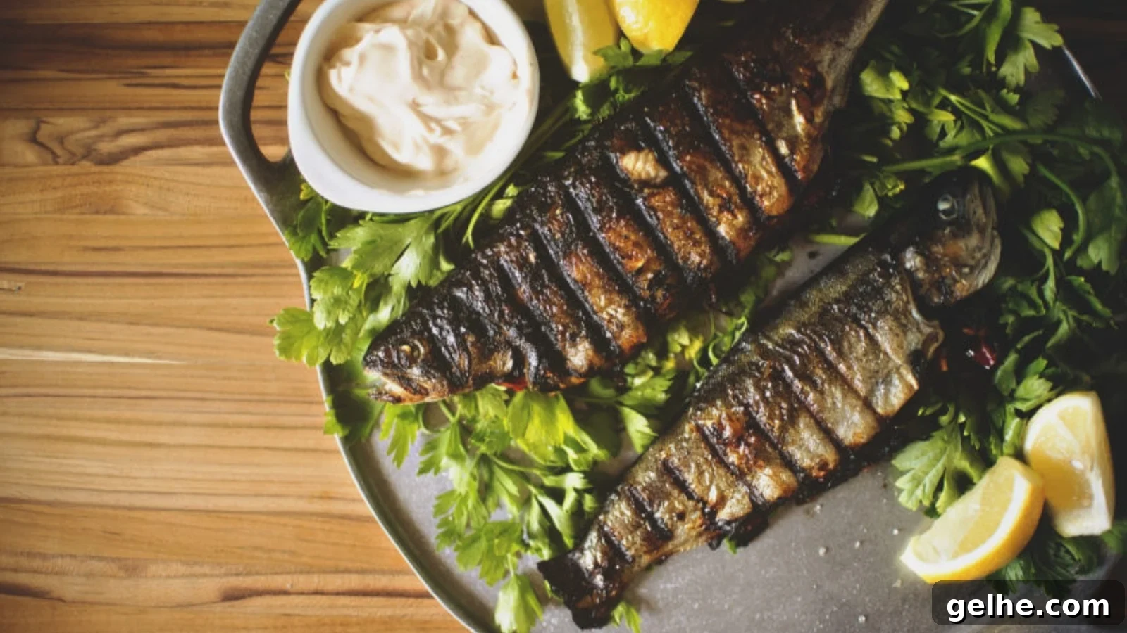Rainbow trout stuffed with herbs grilled with crisped skin.