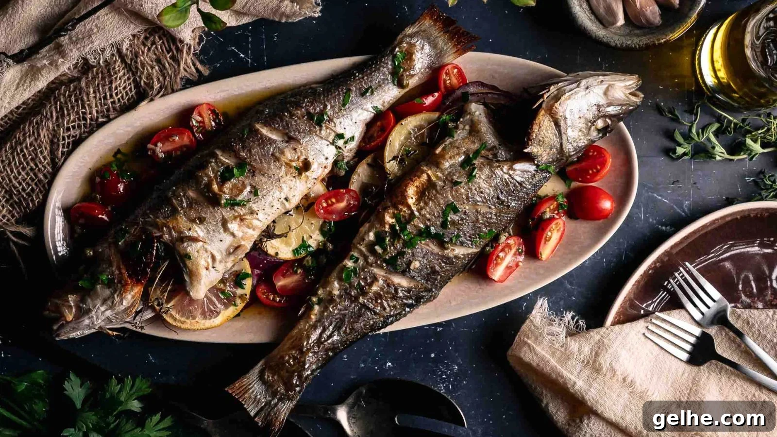Whole roasted branzino drizzled in lemon caper sauce with crispy skin and bright herbs on top.