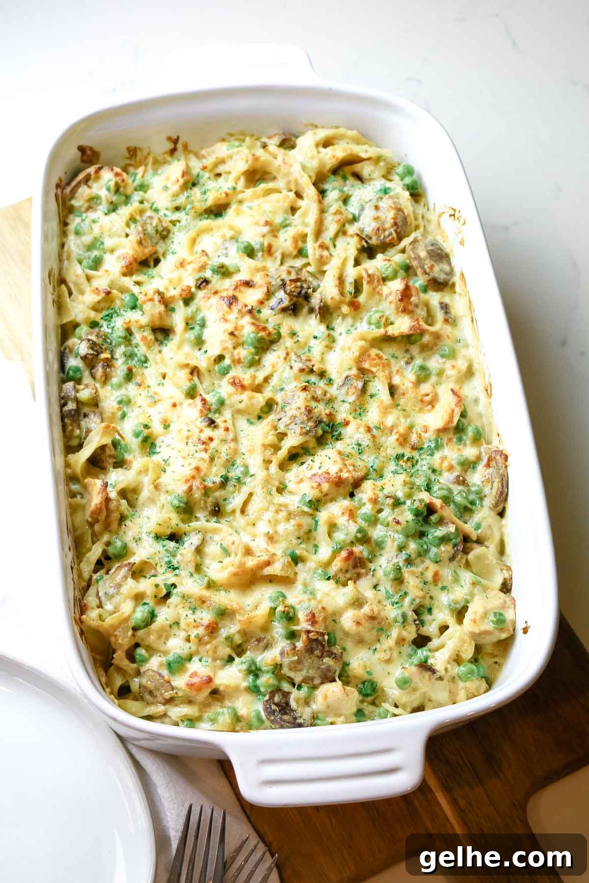 tuna noodle casserole in white baking dish.