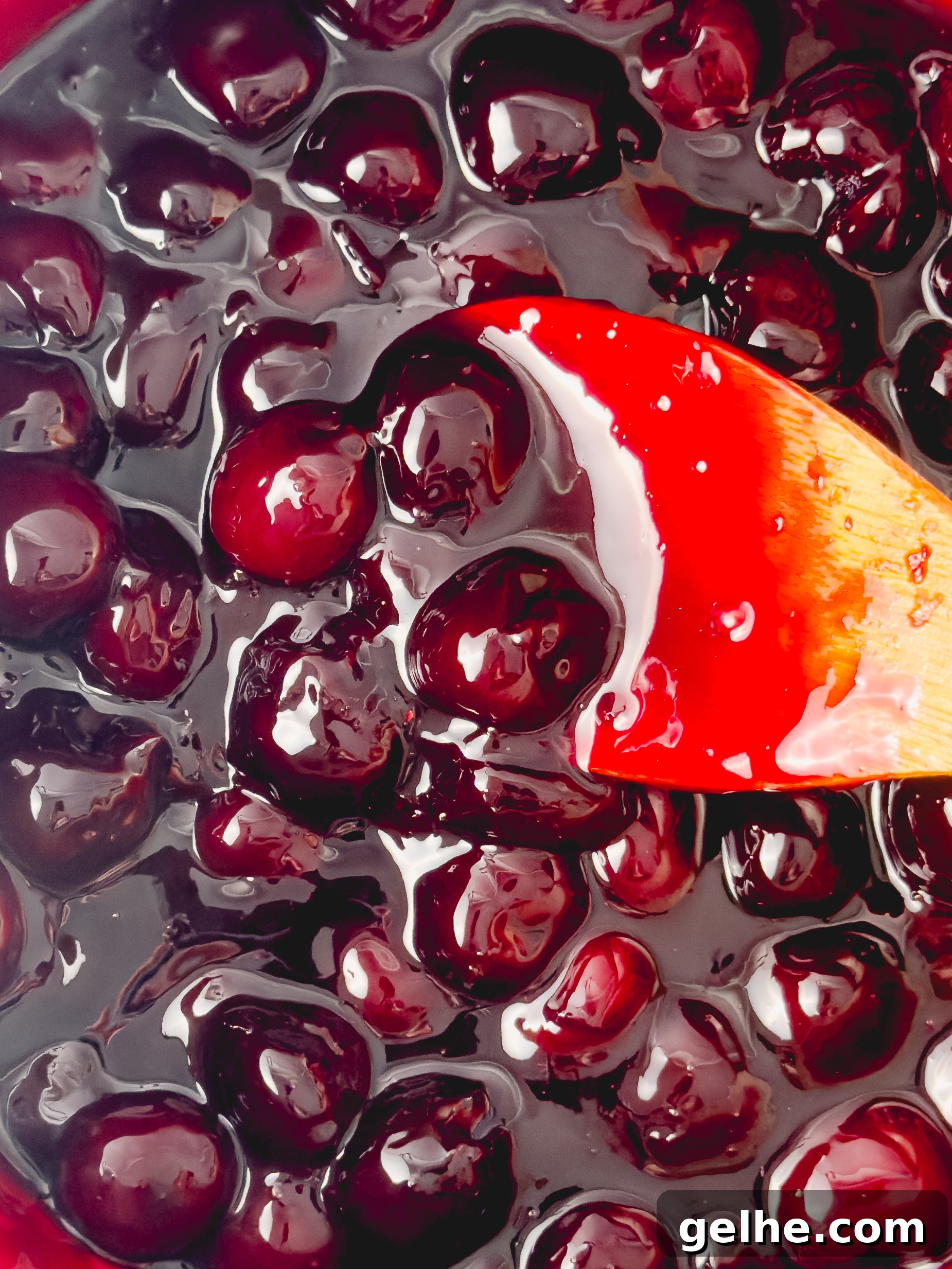 Cherry compote spooned over dessert