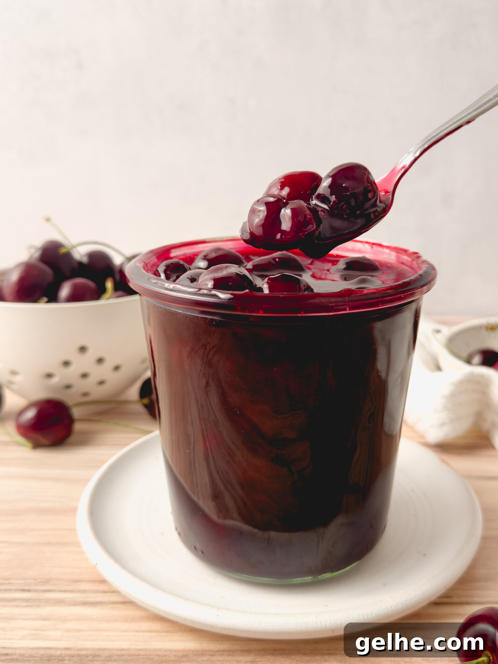 Cherry compote jar with spoon
