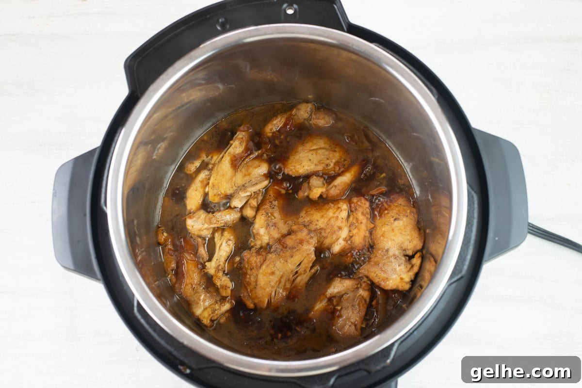 The cooked chicken adobo before thickening the sauce.