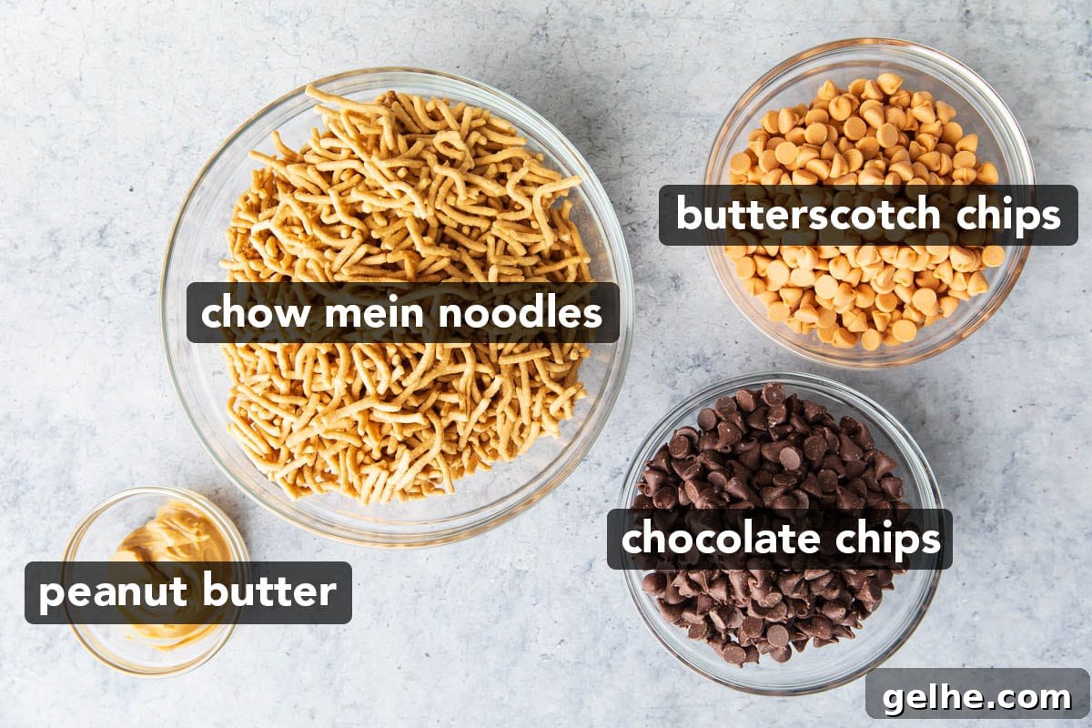 Haystack cookie recipe ingredients scooped into bowls including chow mien noodles, chocolate chips, butterscotch chips, and peanut butter.