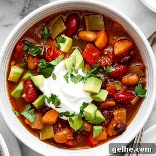 A white bowl of vegetarian chili.