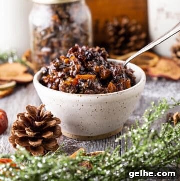 Gluten-Free Suet Mincemeat Recipe for Classic Pies 17 Bowl of gluten-free mincemeat, fruits plump and glistening surrounded by Christmas foliage.
