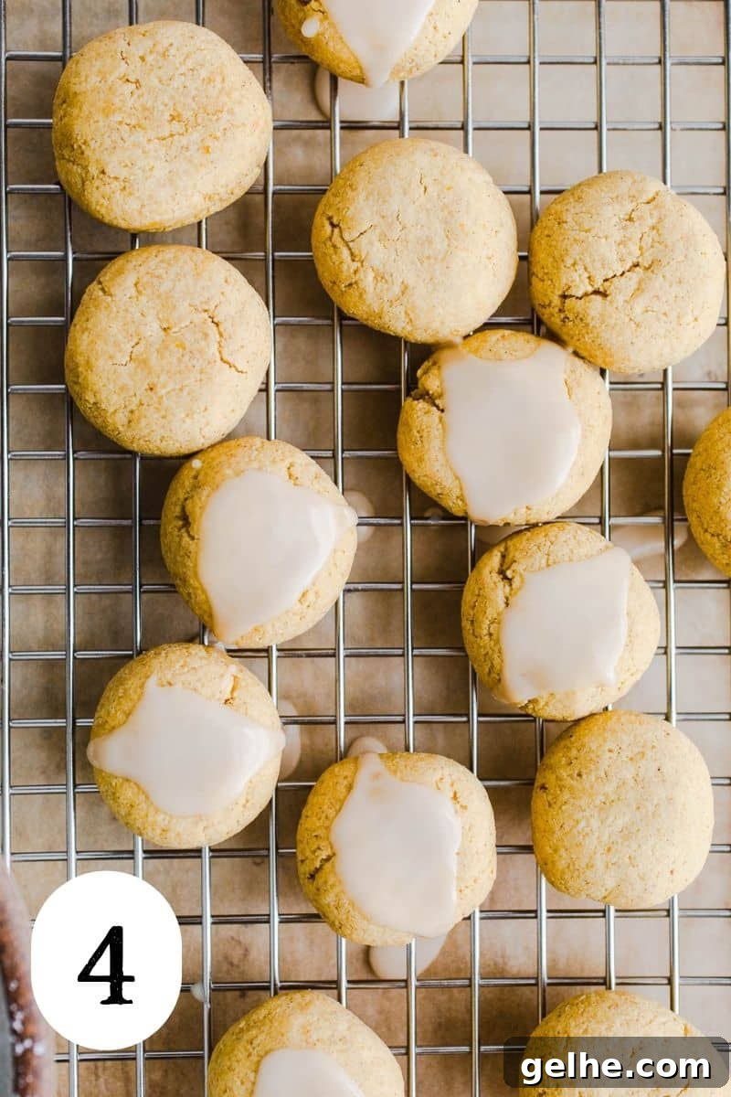 Iced cookies on a wire rack.