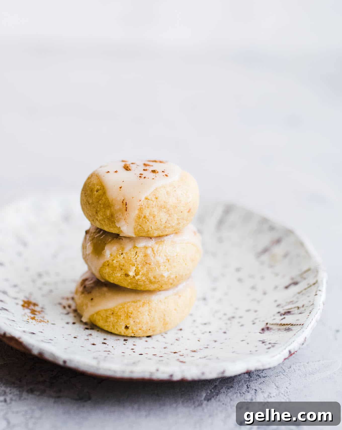 Small cookies stacked on a plate.