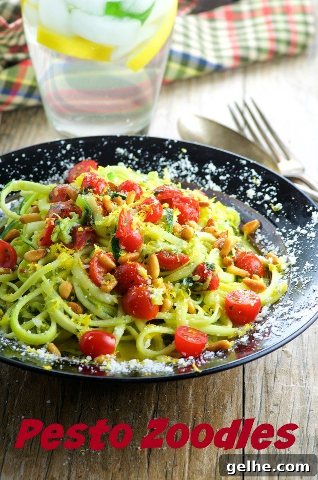 A plate of zoddles topped with roasted tomatoes and parmesan cheese