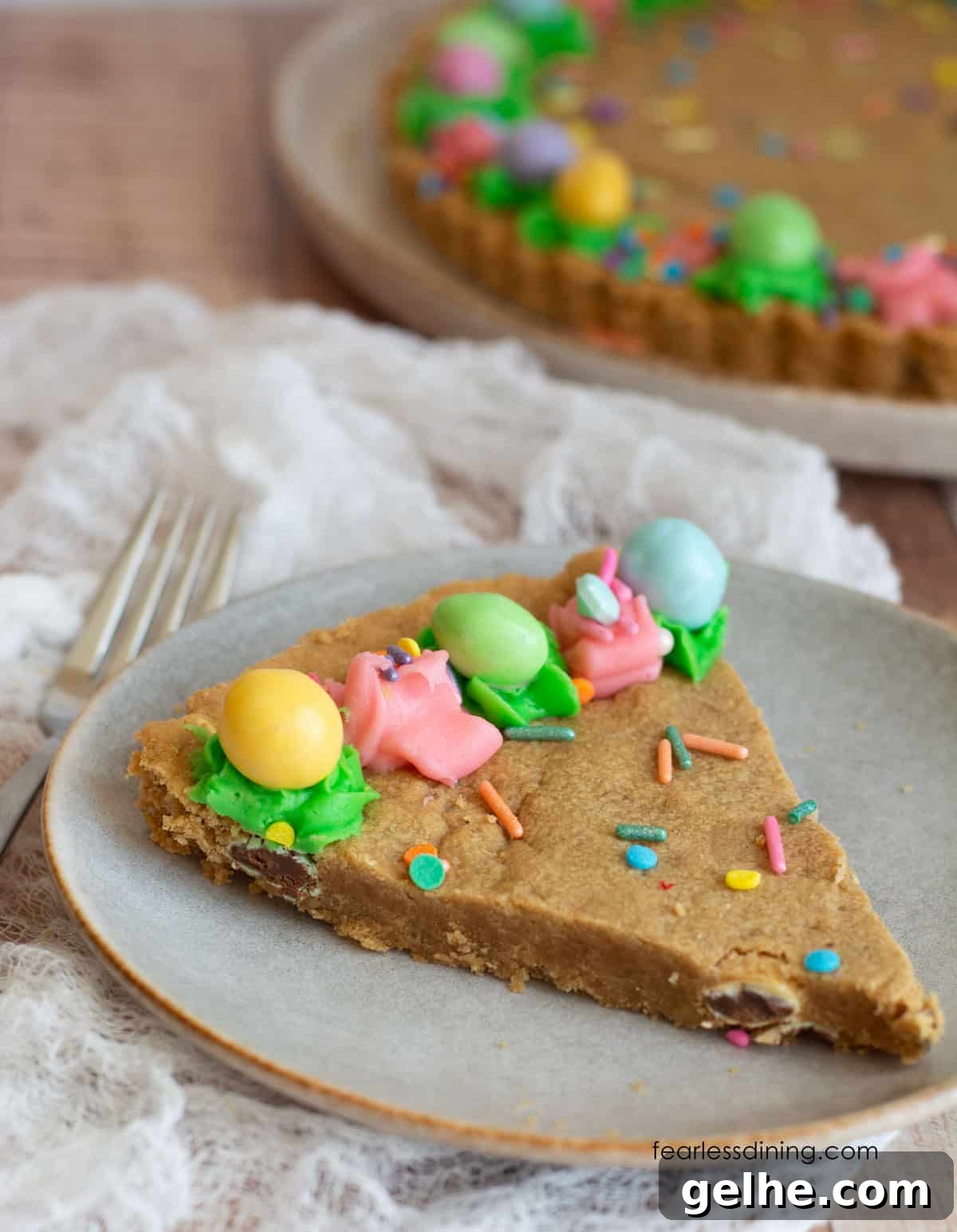 Gluten-Free Peanut Butter Cookie Cake Recipe for Dense, Chewy Slices 6 A slice of the peanut butter cookie cake on a plate.