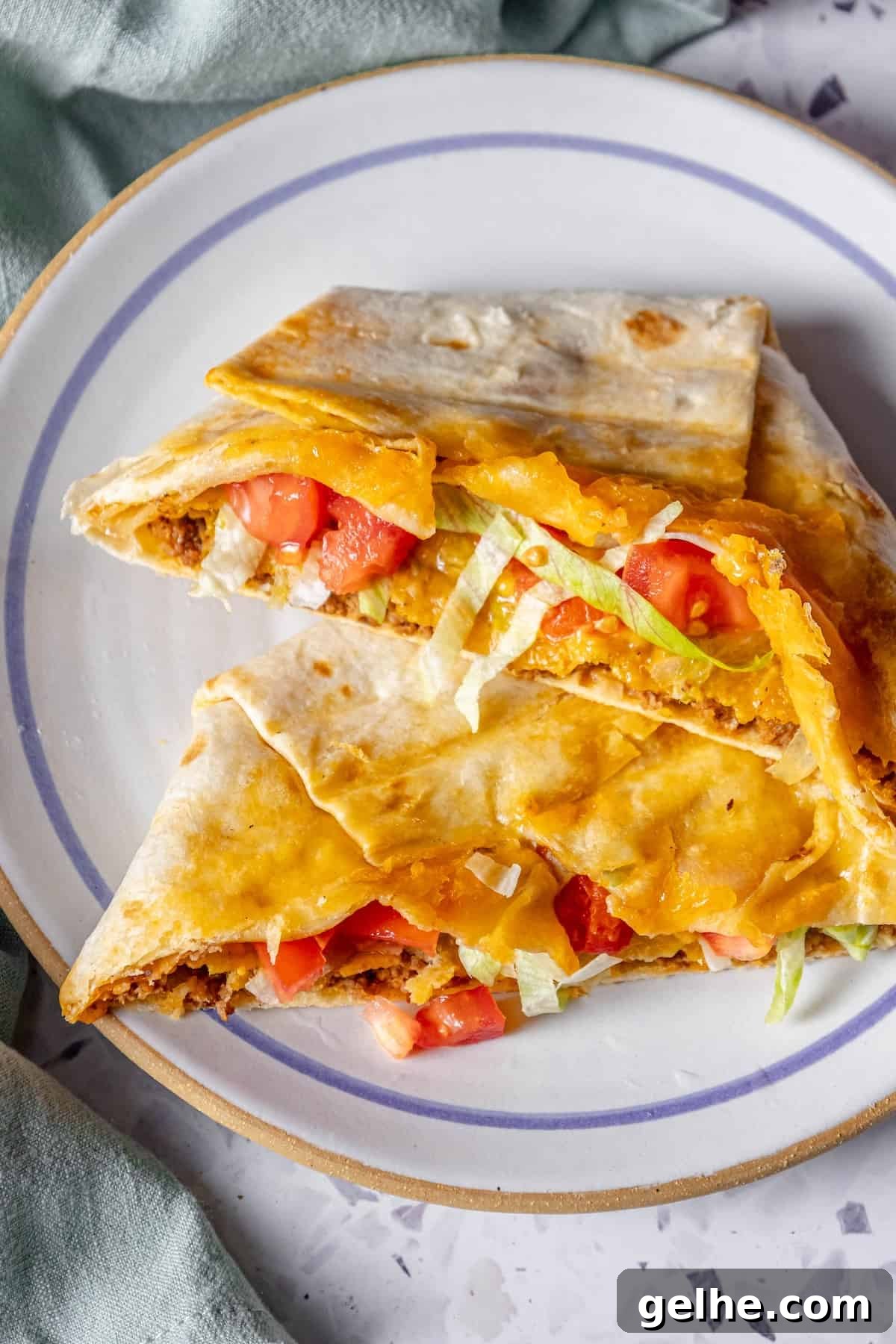Crispy Homemade Crunchwrap Recipe: Copycat Taco Bell Wrap 3 Homemade chicken quesadilla on a plate.