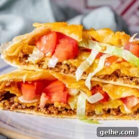 Crispy Homemade Crunchwrap Recipe: Copycat Taco Bell Wrap 21 Homemade CrunchWrap with tomatoes and lettuce.