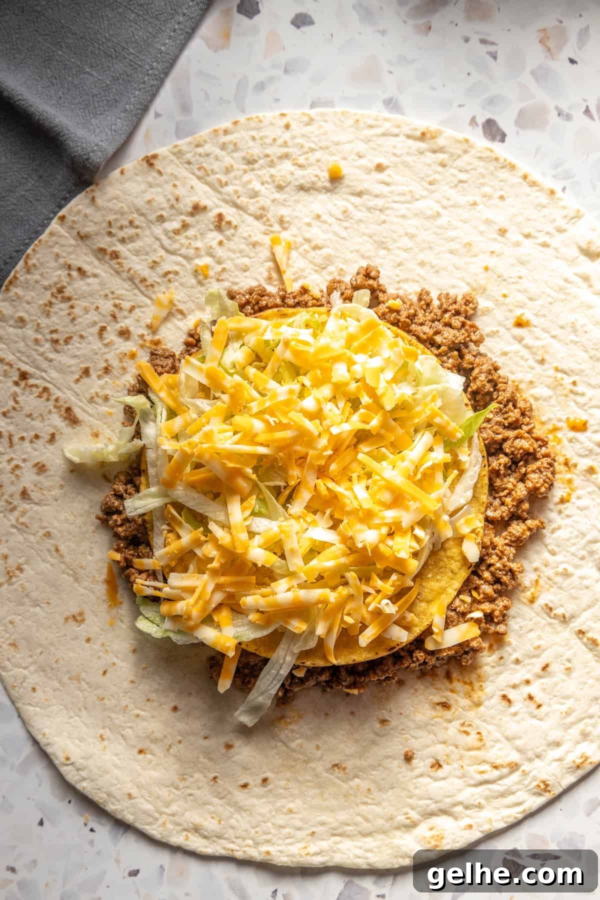 Crispy Homemade Crunchwrap Recipe: Copycat Taco Bell Wrap 7 A homemade burrito stuffed with meat and cheese.