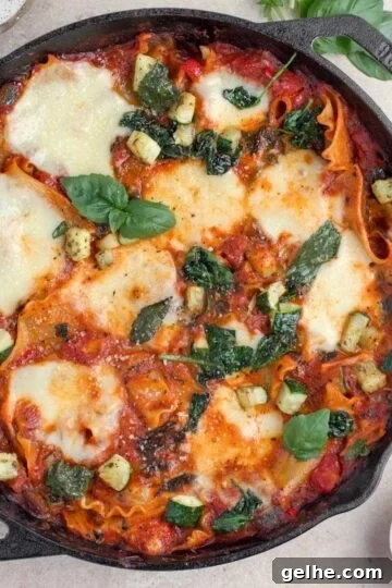 Overhead view of vegetarian lasagna in a cast iron skillet.