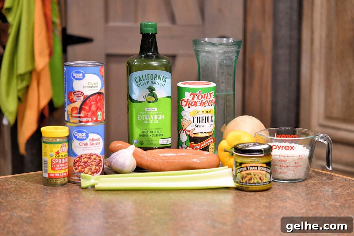 ingredients for cajun sausage and beans on a countertop