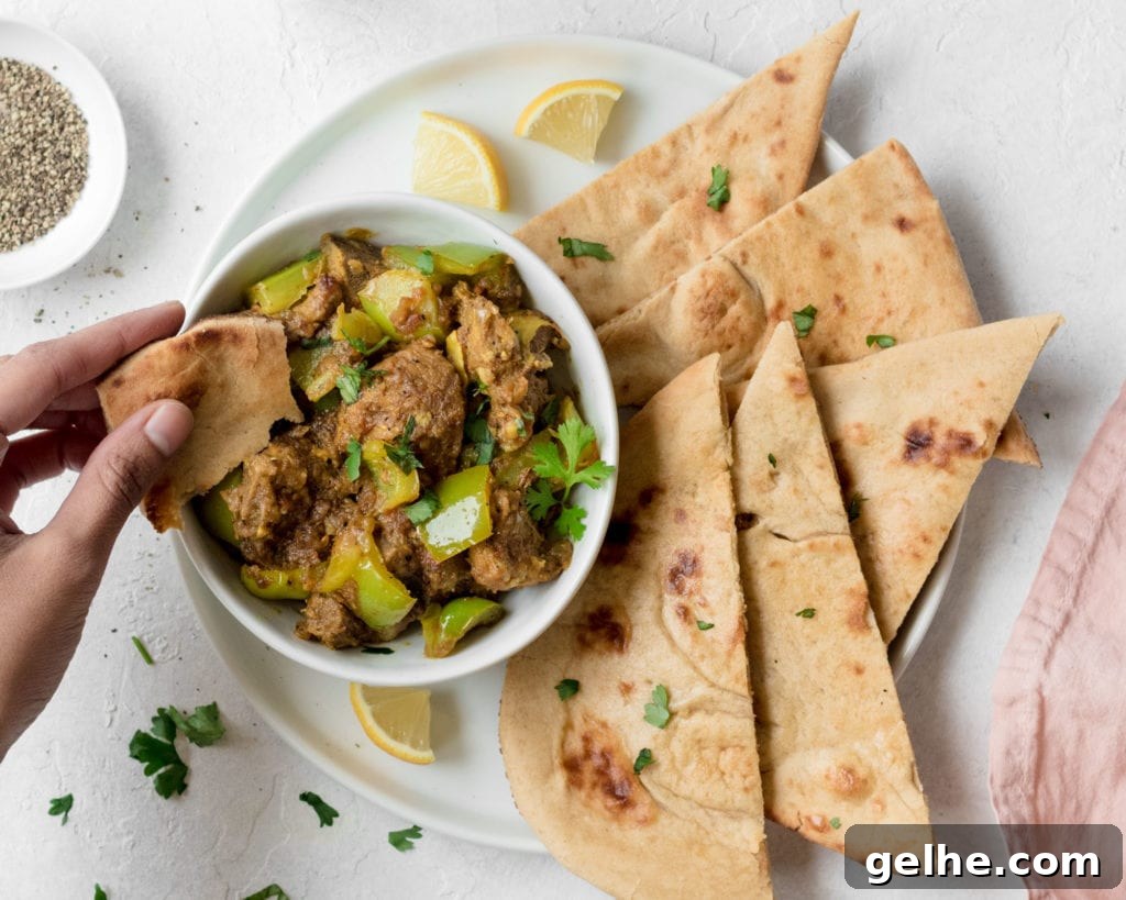 Instant Pot Goat Curry with Bell Peppers 3 Picking up some Instant Pot Goat and Bell Pepper Curry with a piece of naan.