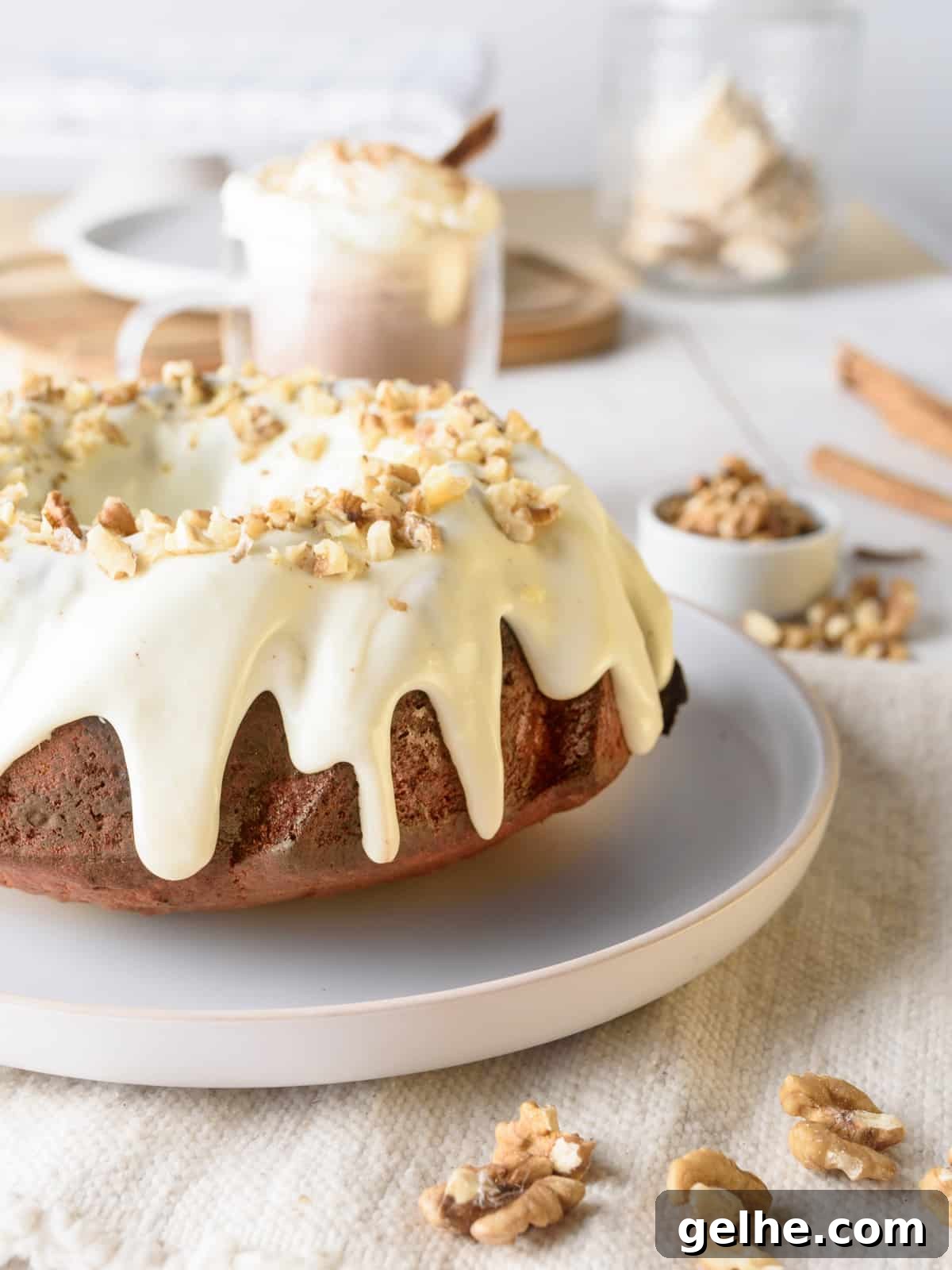 pumpkin bundt cake with cream cheese glaze on a platter