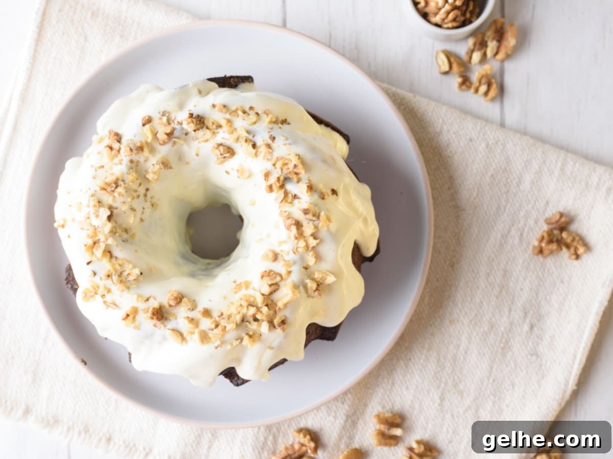 pumpkin bundt cake with cream cheese glaze and nuts