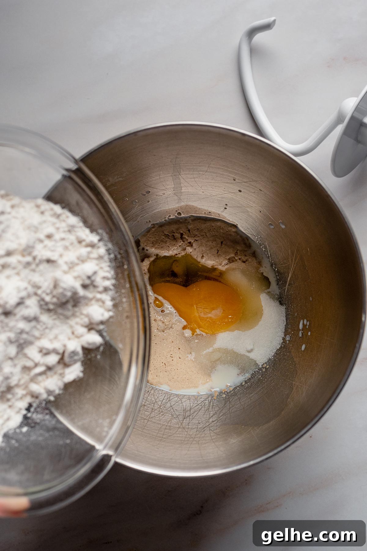 Dough ingredients added to the mixer bowl.